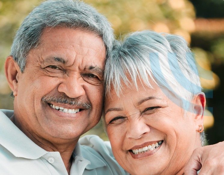 Mr. and Mrs. Sharma smiling together